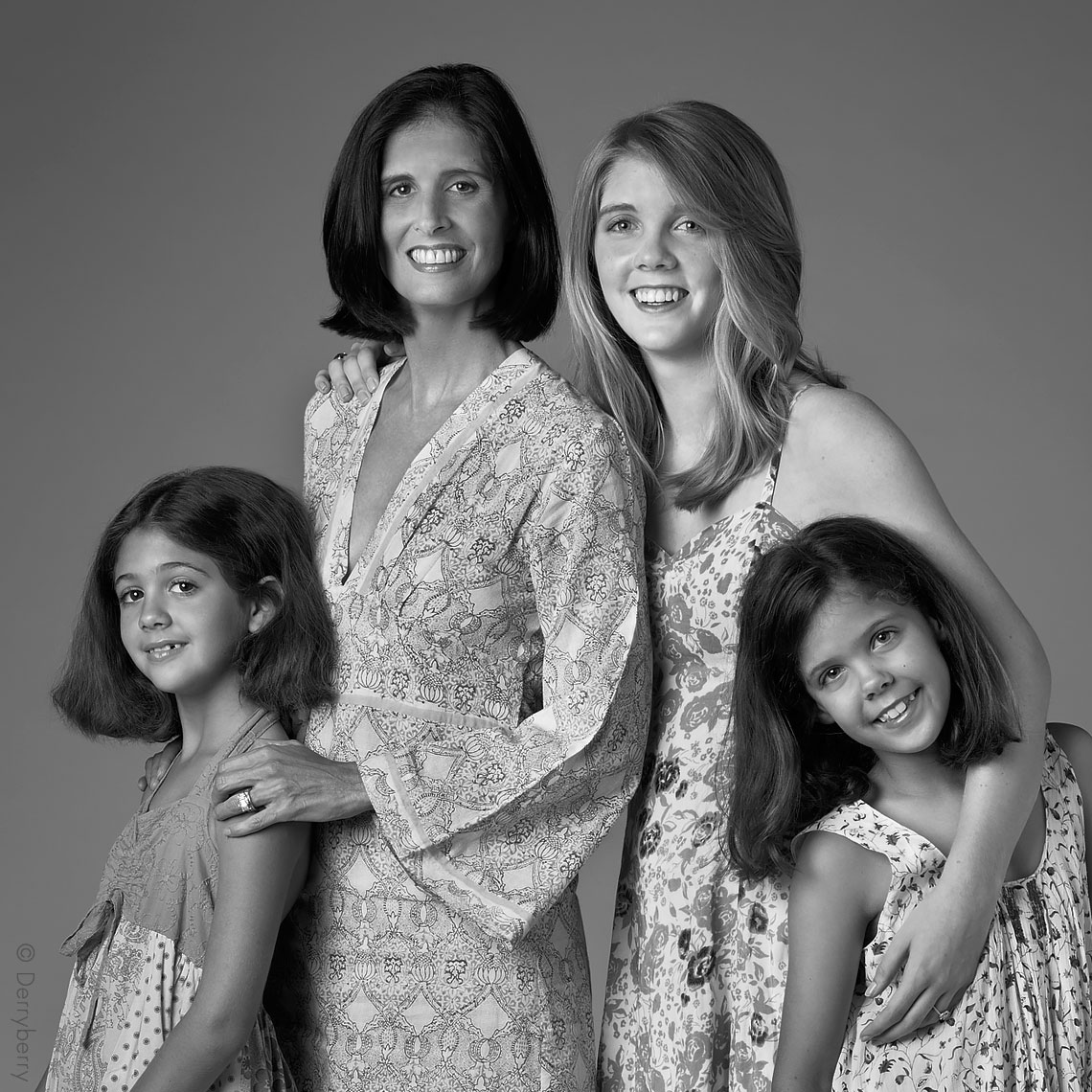 Black and white group portrait of the Horchow, Fearon, Pilsberry family girls in the studio  in Dallas, Texas by photographer John Derryberry Photography