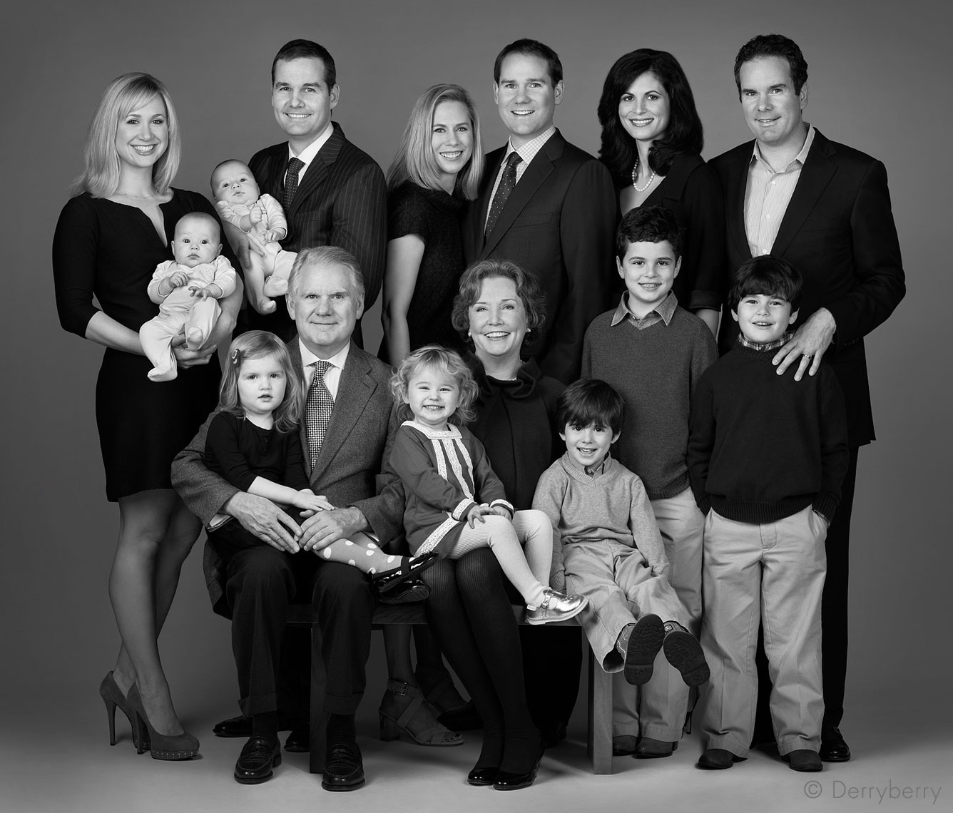 Black and white extended group portrait of the  Stewart family in the studio by photographer, John Derryberry Photography
