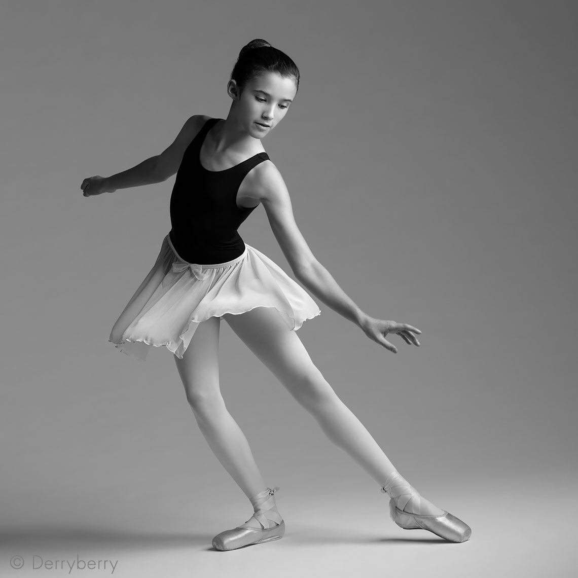 portrait of a young, tween ballet dancer in the studio in black and white in Dallas, Texas by photographer John Derryberry Photography