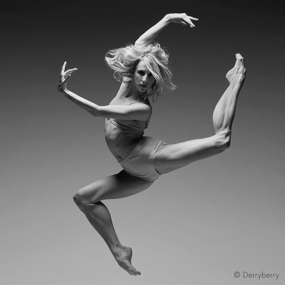 Black and white portrait of ballet principal dancer Colodney jumping in the studio  Dallas, Texas by photographer John Derryberry Photography