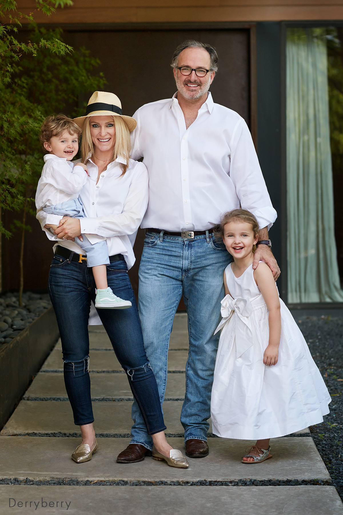 Color portrait of the Parker Tompkins family in the modern house close to White Rock Lake  in Dallas, Texas by photographer John Derryberry Photography