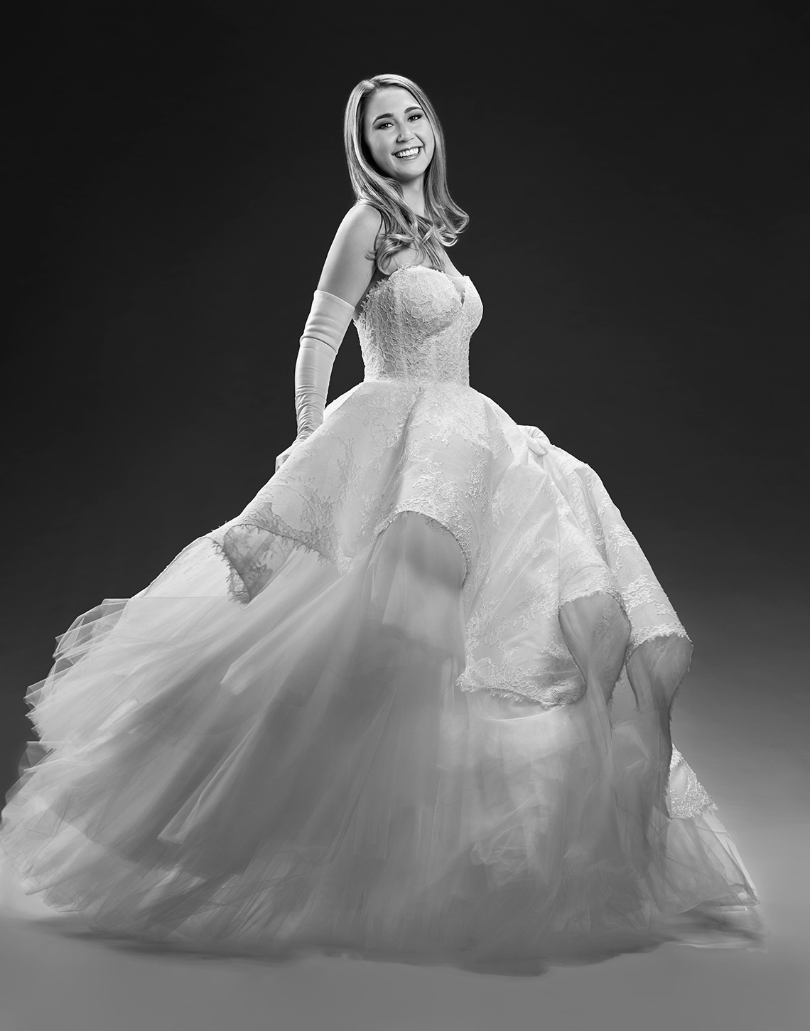 International debutant portrait of a girl swirling in her beautiful gown by John Derryberry