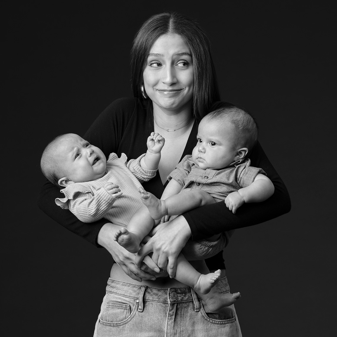Portrait of a teenage girl hold baby twins