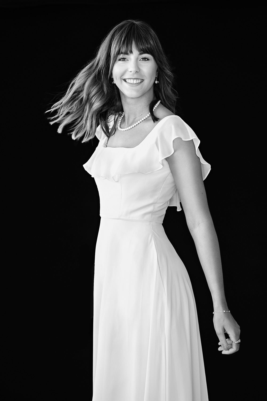 Weeldreyer black and white graduation day portrait in a white dress