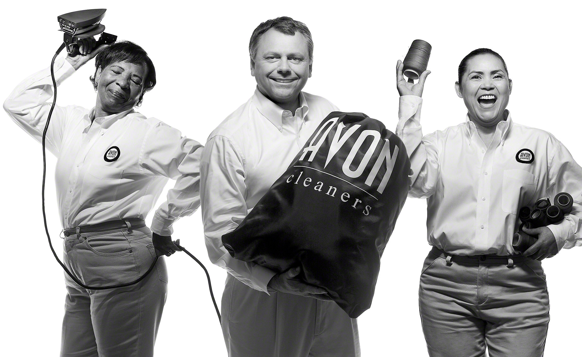 Black and white group business portrait for Avon Cleaners in Dallas, Texas by photographer John Derryberry Photography