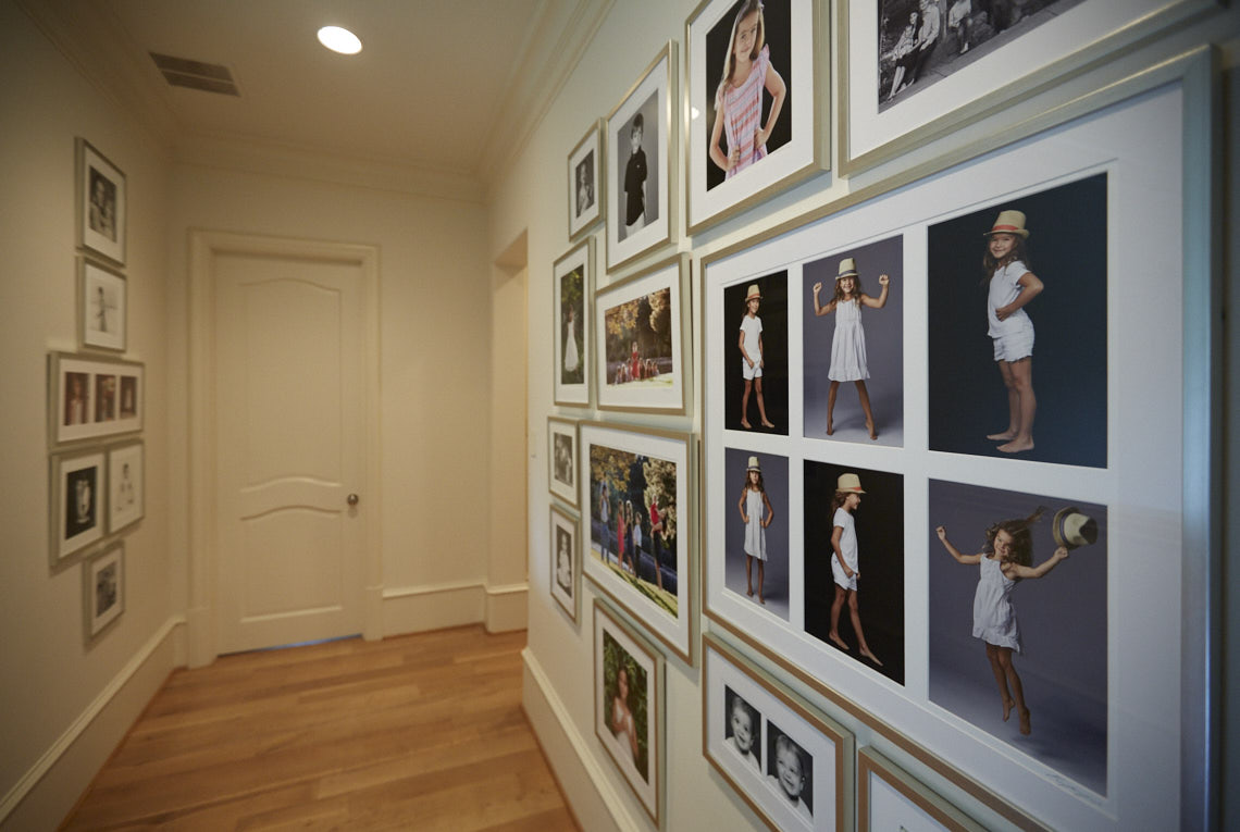 Beecherl home hall  wall gallery  collection of portraits by Dallas, Texas photographer John Derryberry Photography
