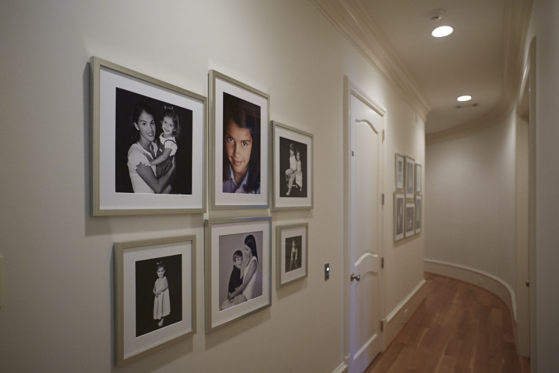 Beecherl home hall  wall gallery  collection of portraits by Dallas, Texas photographer John Derryberry Photography