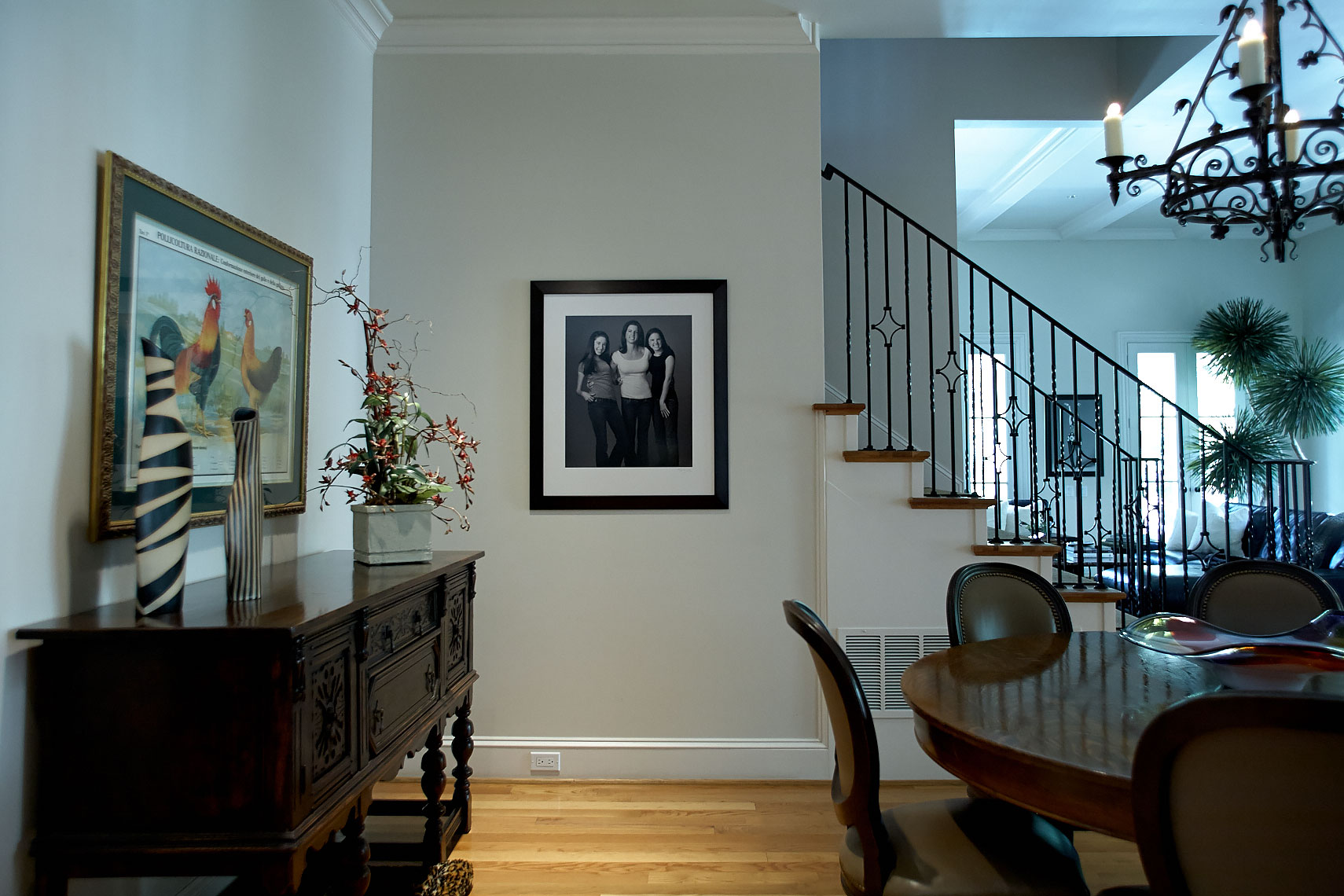 Home  gallery wall collection near the stairs of portraits by Dallas, Texas photographer John Derryberry Photography