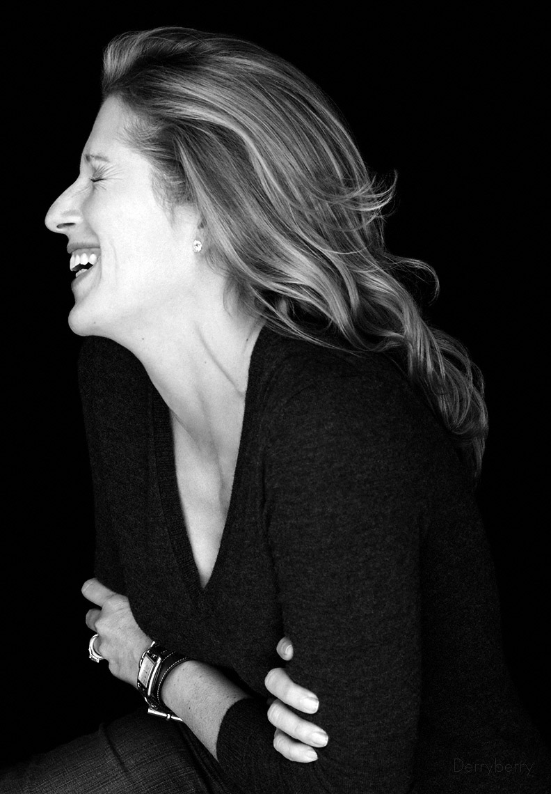 Black and white portrait of  designer Shari Markbreiter laughing in the studio in New York City   in Dallas, Texas by photographer John Derryberry Photography