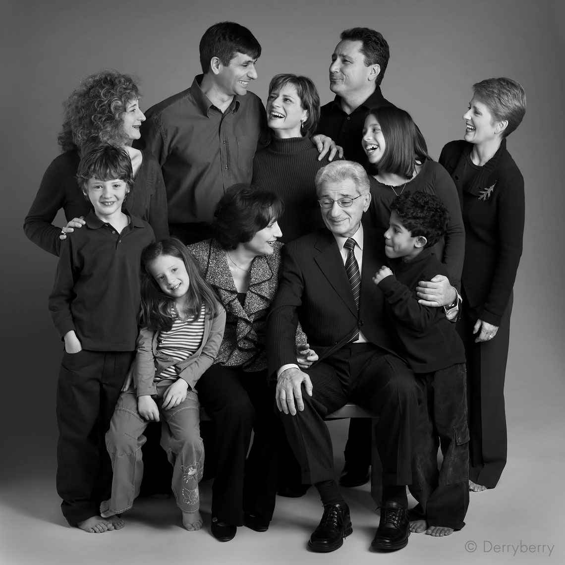 Black and white extended group of the Saada family in the studio  in Dallas, Texas by photographer John Derryberry Photography
