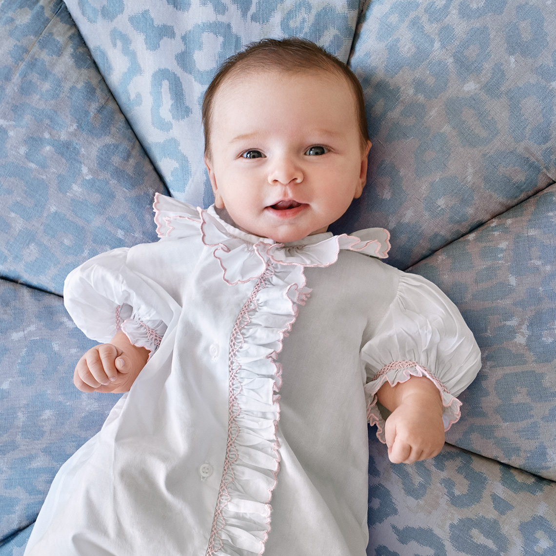 Close-up   color portrait of a baby girl lying down on her grand mother